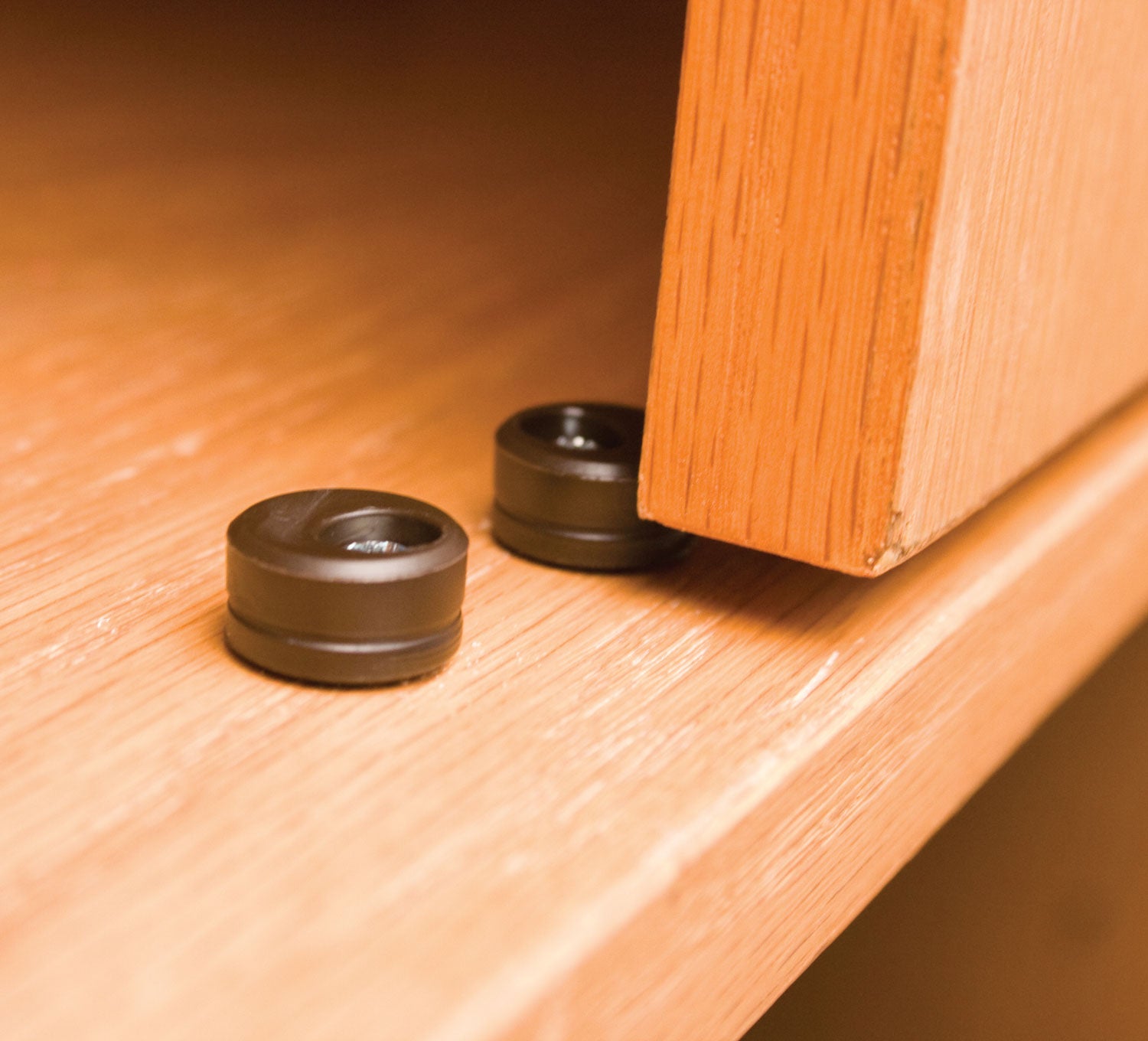Euro cabinet door stops in a 10 pack, designed to prevent cabinet doors from slamming and protect surfaces.