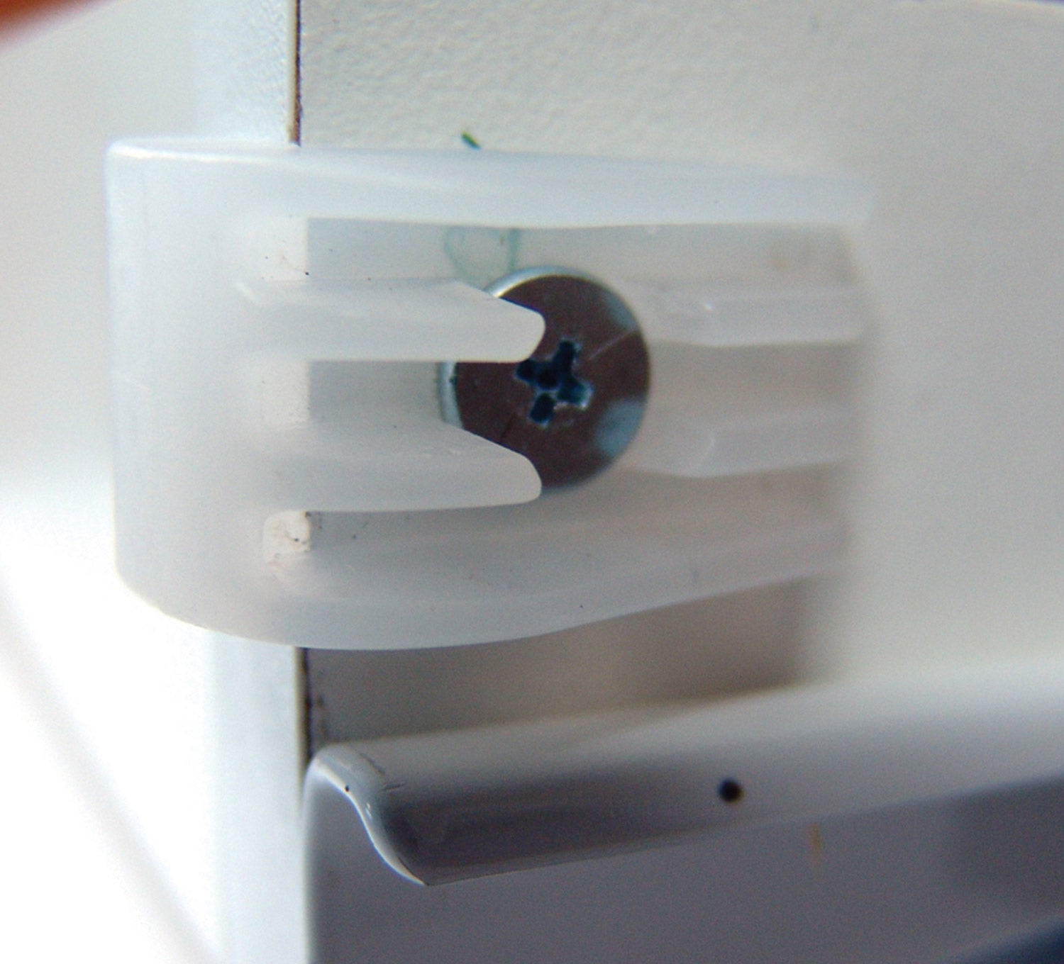 Clear drawer bumpers installed on a cabinet, designed to prevent noise and protect surfaces. 10 pack available.