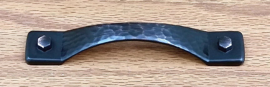 Rustic hammered drawer pull in oil rubbed bronze finish with two decorative bolts on each end. Ideal for cabinets.