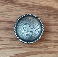 Engraved knob with rope edge design in an old silver finish, perfect for cabinets or furniture accents.