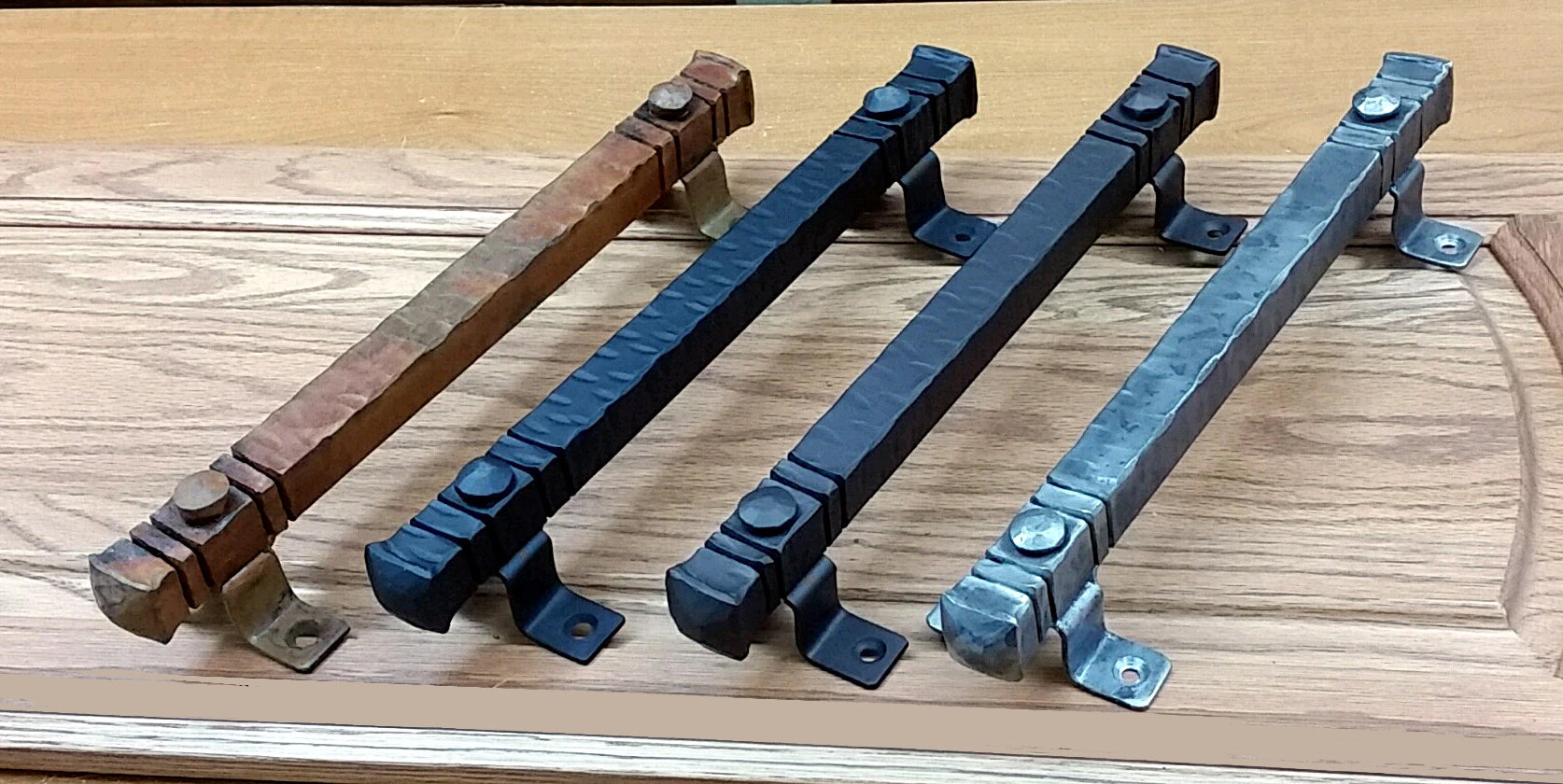 Jumbo 14-inch bridge door pulls in various finishes for barn doors, showcasing sturdy designs and mounting hardware.