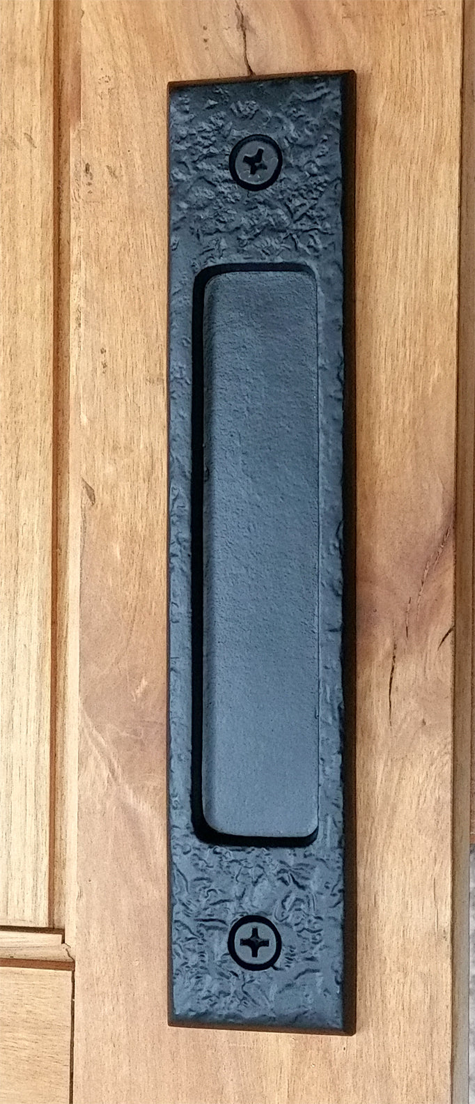 Large flush pull barn door handle with a distressed texture, designed for easy mounting and available in multiple finishes.