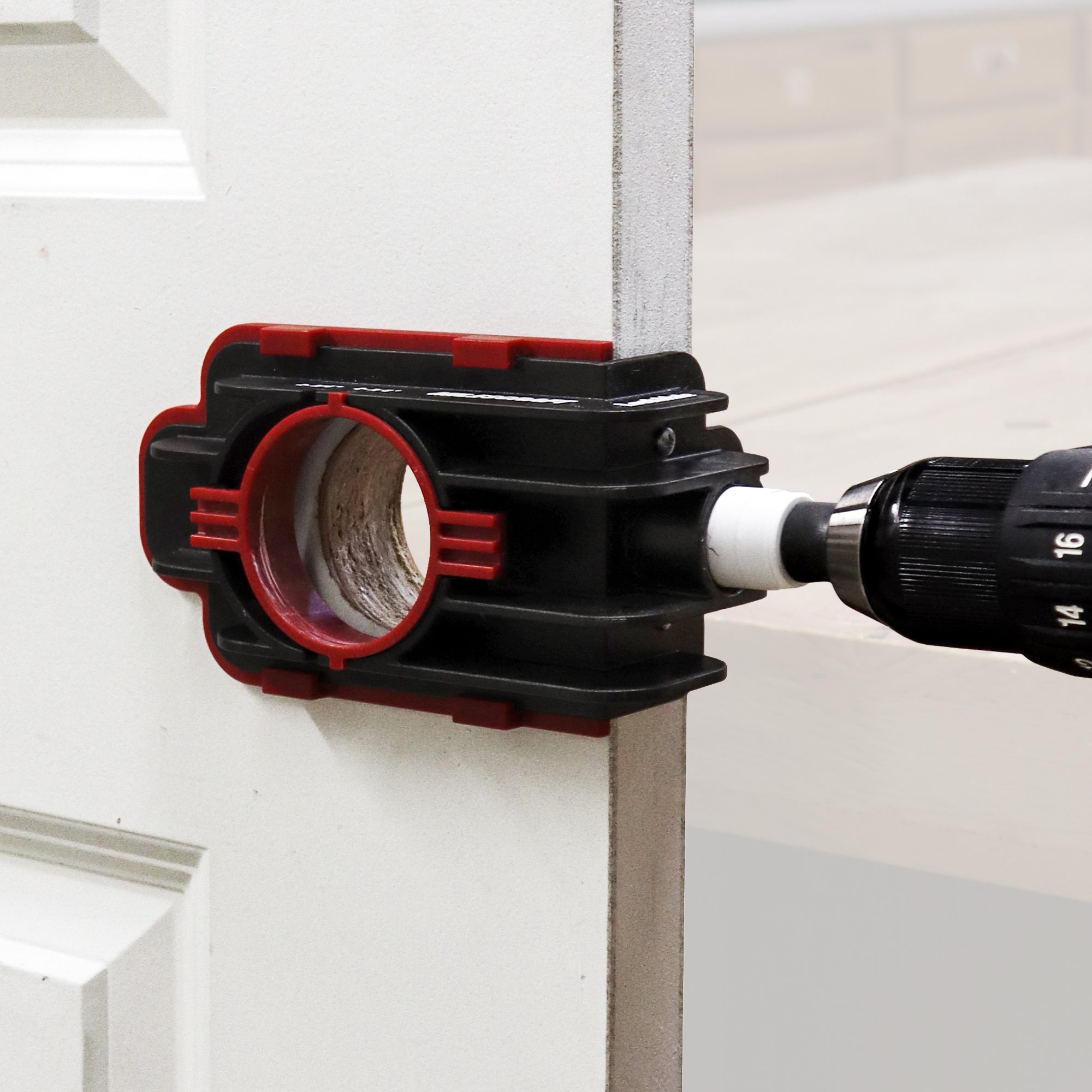 LockMate installation jig securely guides drilling for locks on doors, ensuring precise alignment and easy installation.