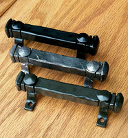 Mini 4-inch bridge door pulls in three finishes: black, graphite, and antique bronze, ideal for stylish door hardware.