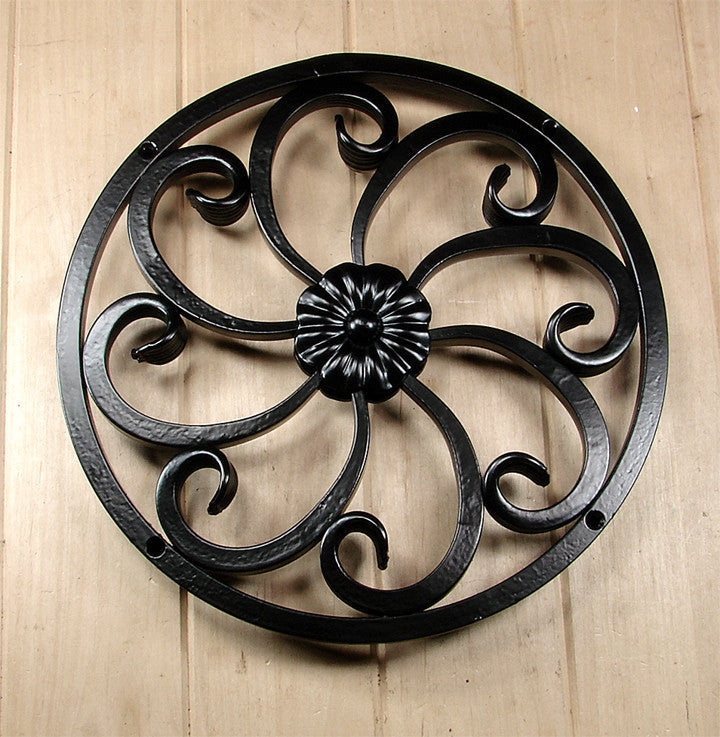 Round door and gate grille featuring a floral center design and fishtail scroll work, 11-5/8 inches, available in multiple finishes.