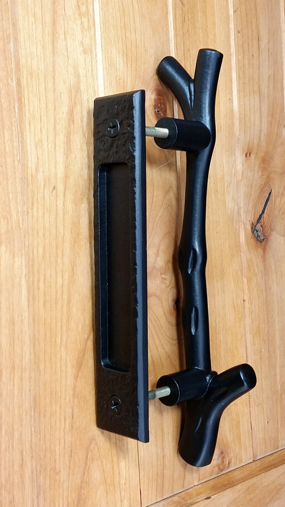 Large tree branch barn door handle with matching textured flush pull, available in multiple finishes, sold as a set.