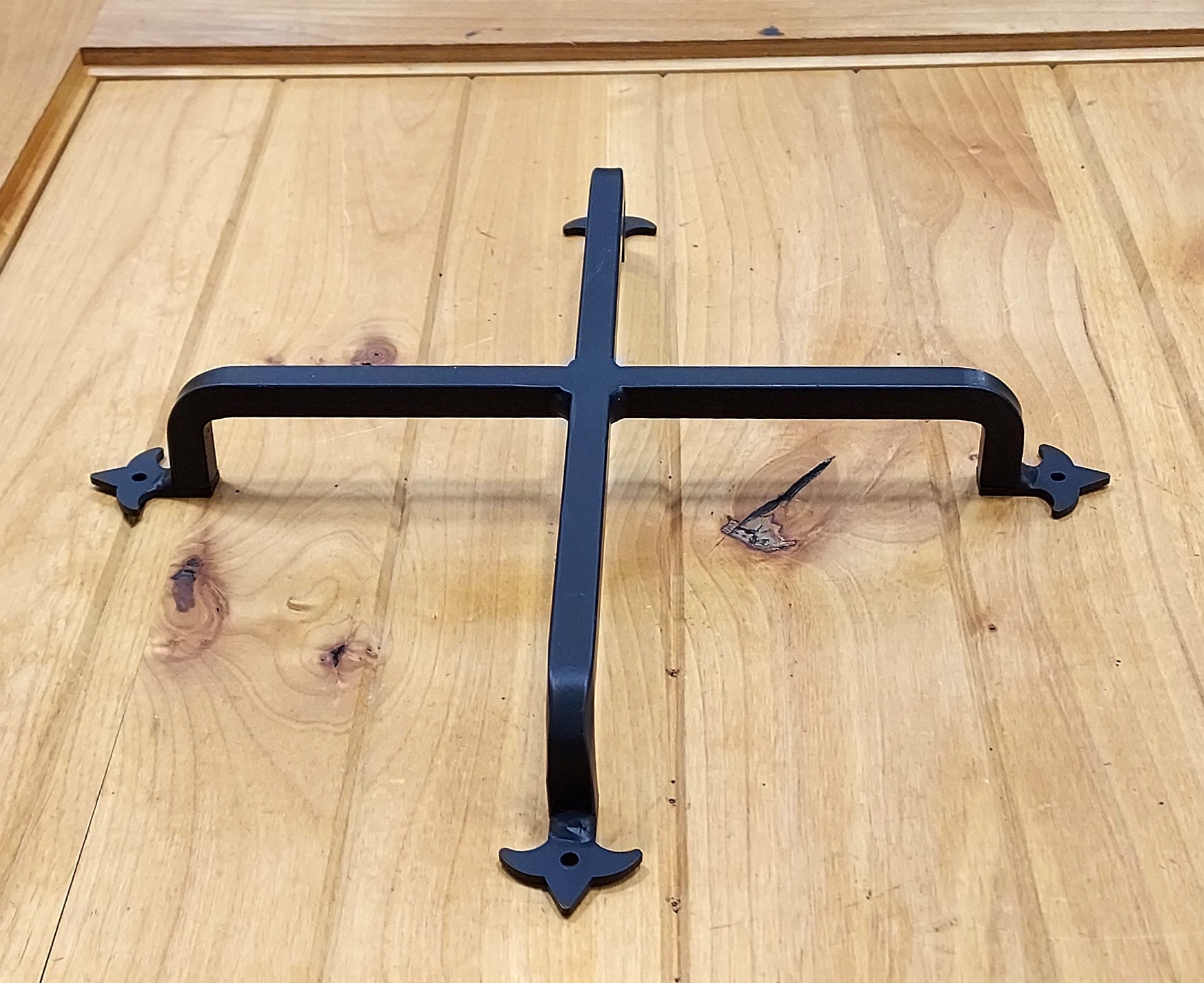 Wrought iron decorative grille in Fleur de Lis style, matte black finish, available in multiple sizes, sold individually.