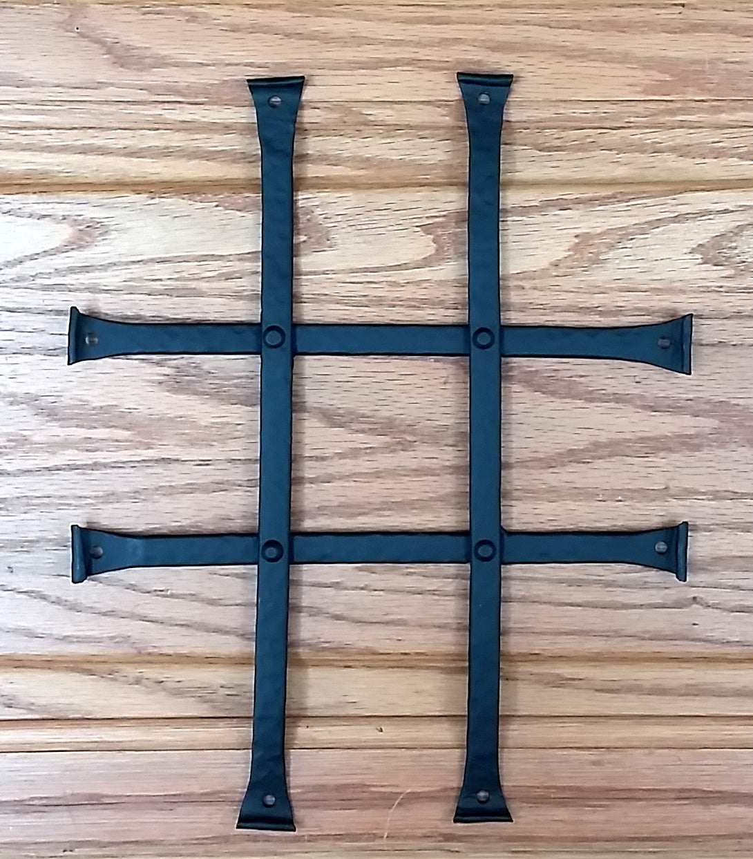 Low profile curled tip door and gate grille in black powder coat finish, measuring 8x10 inches with four bars.