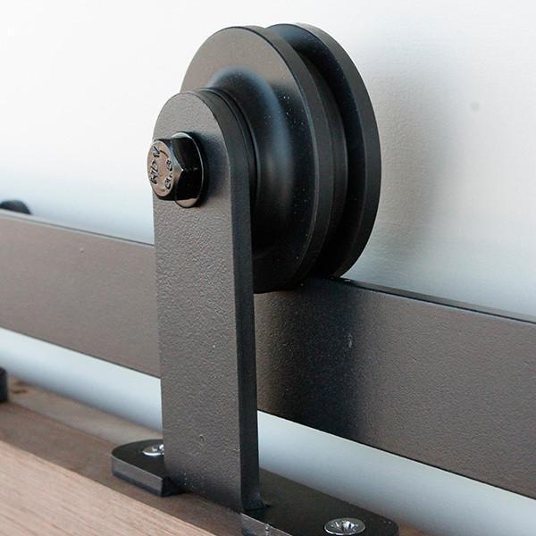 Black barn door hardware kit featuring gage style hinges for doors 30 to 48 inches wide, designed for smooth operation.