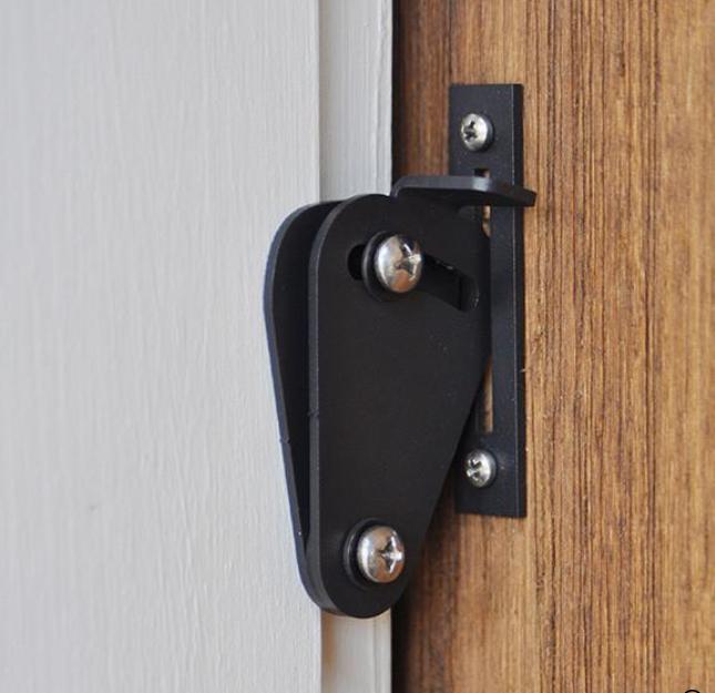 Barn door hinge hardware kit with privacy lock, featuring a sleek design in multiple finishes for stylish functionality.