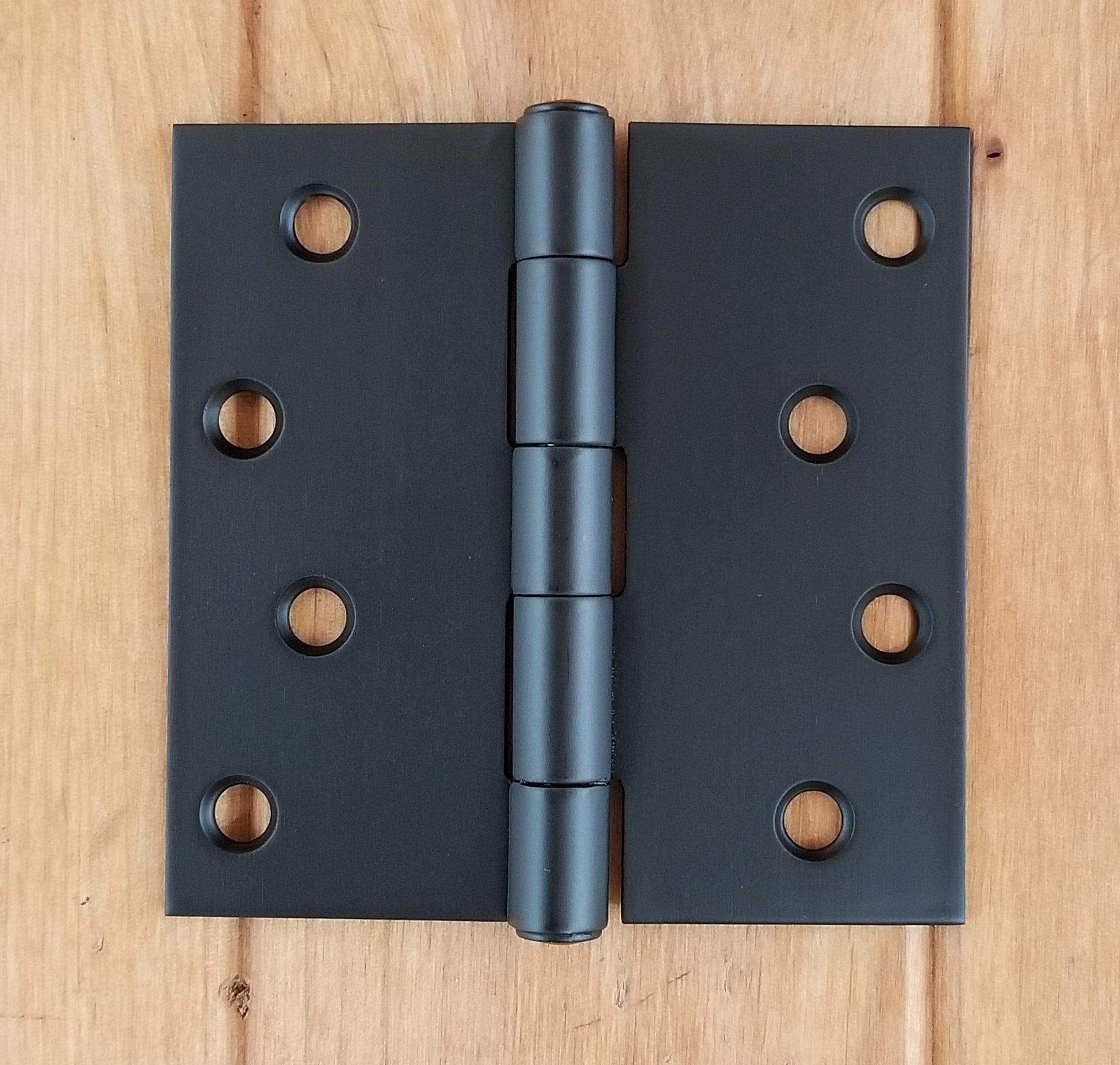 Black stainless steel residential hinges, 4-inch square, rust-resistant, sold in a pack of three. Ideal for doors.