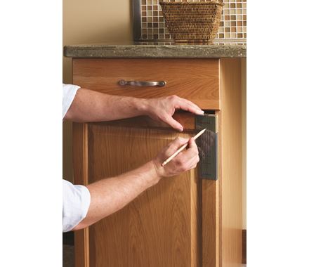 Cabinet door mounting template for knobs and pulls, adjustable from 3 inches to 128mm, used for precise installation.