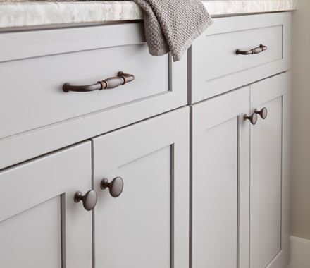 Edona Series 1-1/4 inch cabinet knobs in various finishes, enhancing modern cabinetry with stylish design.
