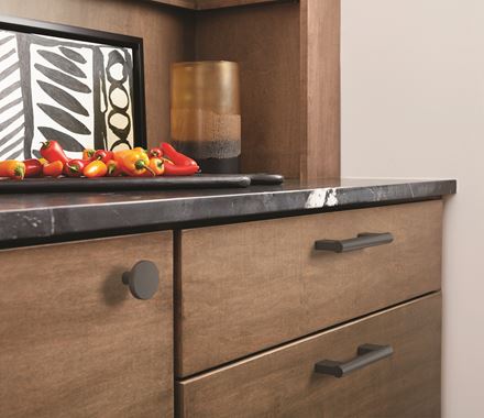 Versa Series cabinet knobs in 1-3/8 inch size, available in multiple finishes, enhancing modern cabinetry.