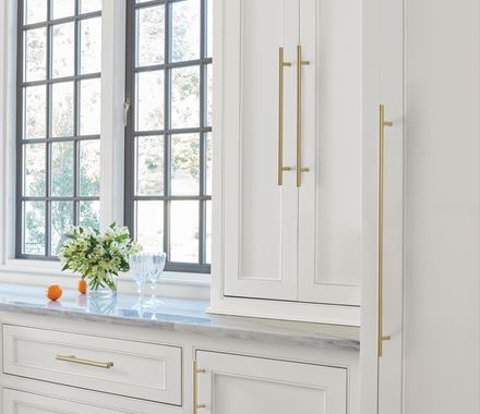 Elegant golden champagne cabinet pull from the Bar Pull Series, 5-1/16" center to center, enhancing modern cabinetry.