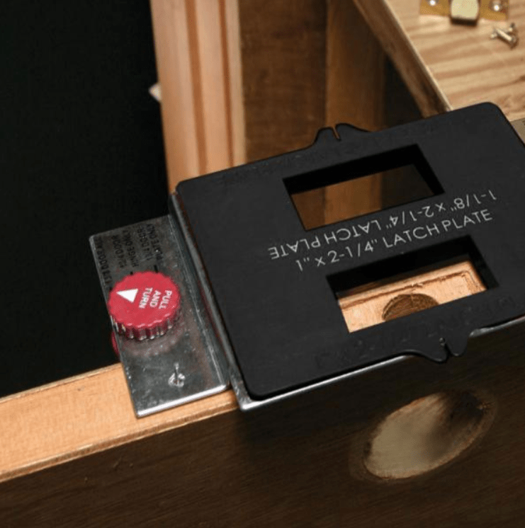 Door hinge jig installation kit with templates and router bits for precise hinge and strike plate placement.