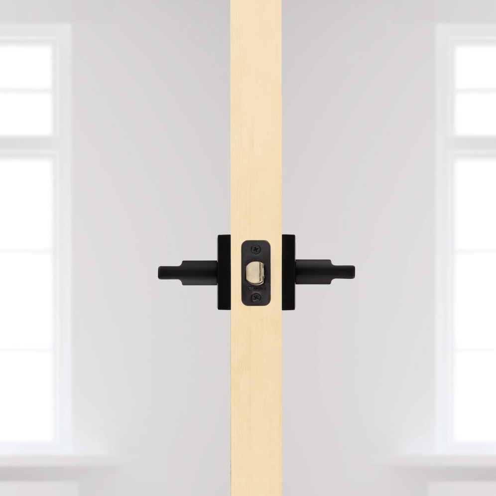 Kwikset Halifax square non-locking passage lever in iron black finish for residential doors, sold individually.