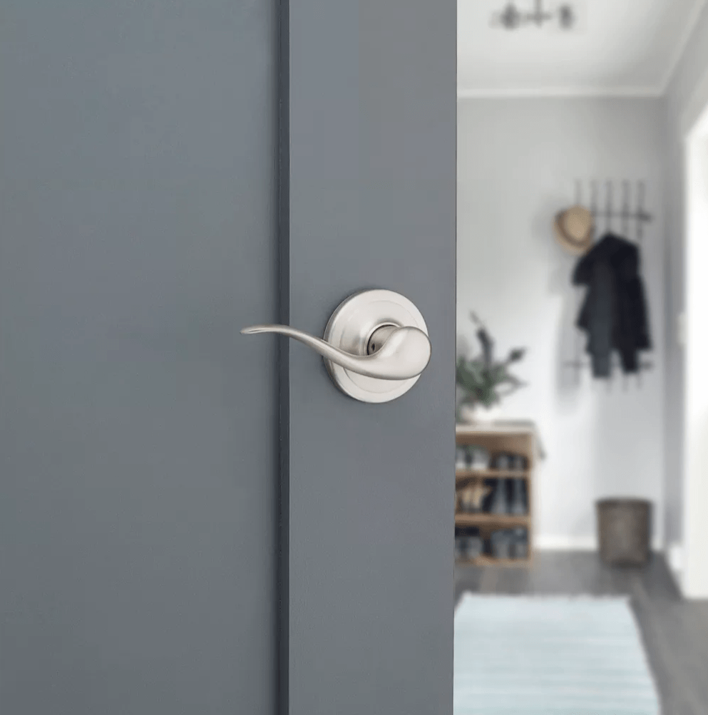 Satin nickel non-locking passage lever door handle in Tustin style with Microban antimicrobial protection.