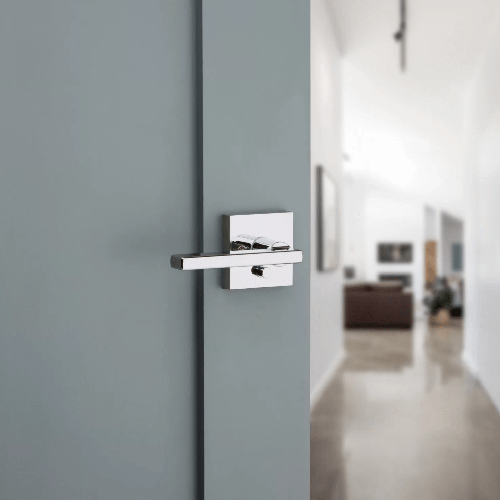 Kwikset Halifax square privacy door lever in bright polished chrome finish, ideal for residential use.
