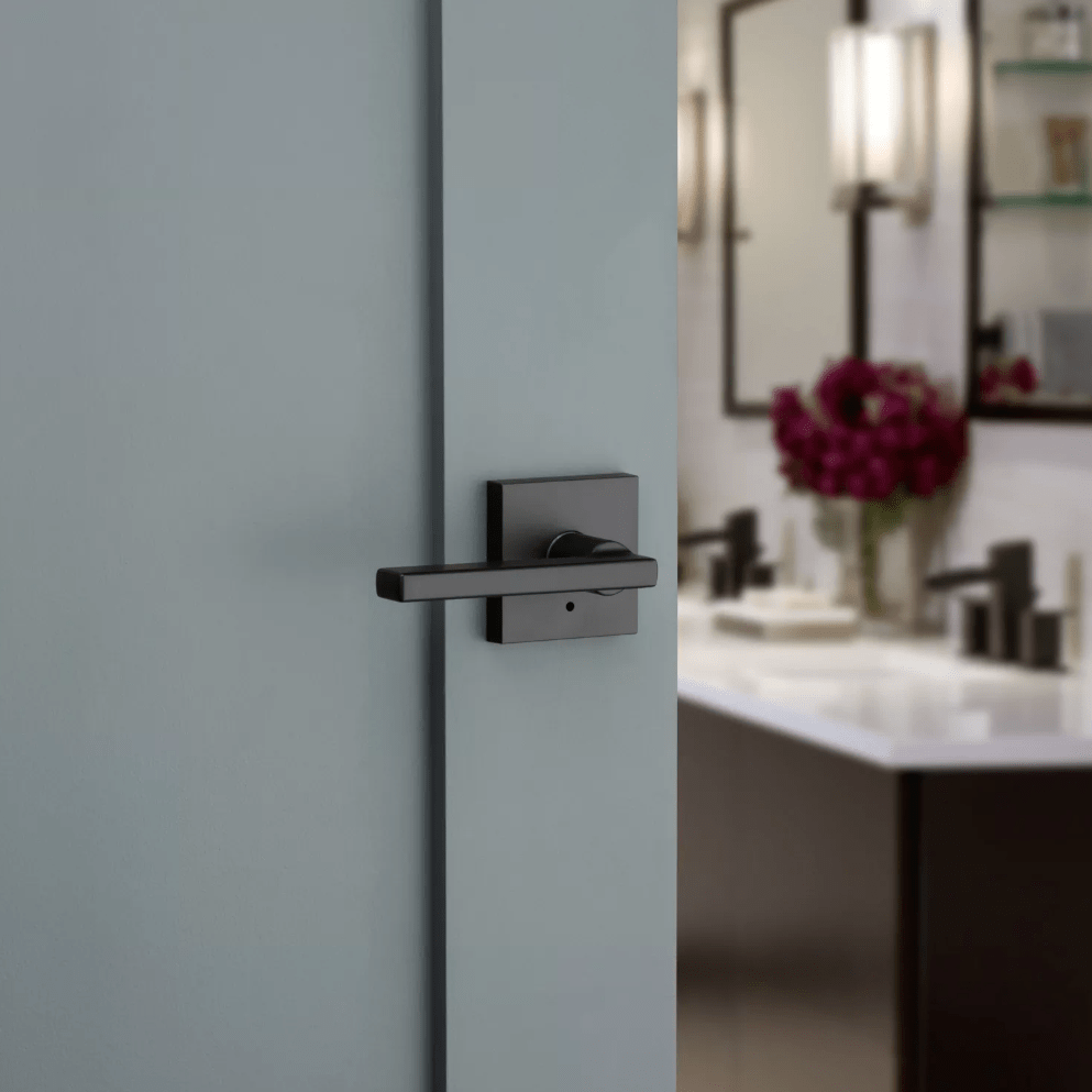 Kwikset Halifax square privacy door lever in iron black finish, ideal for residential use, enhancing modern interiors.