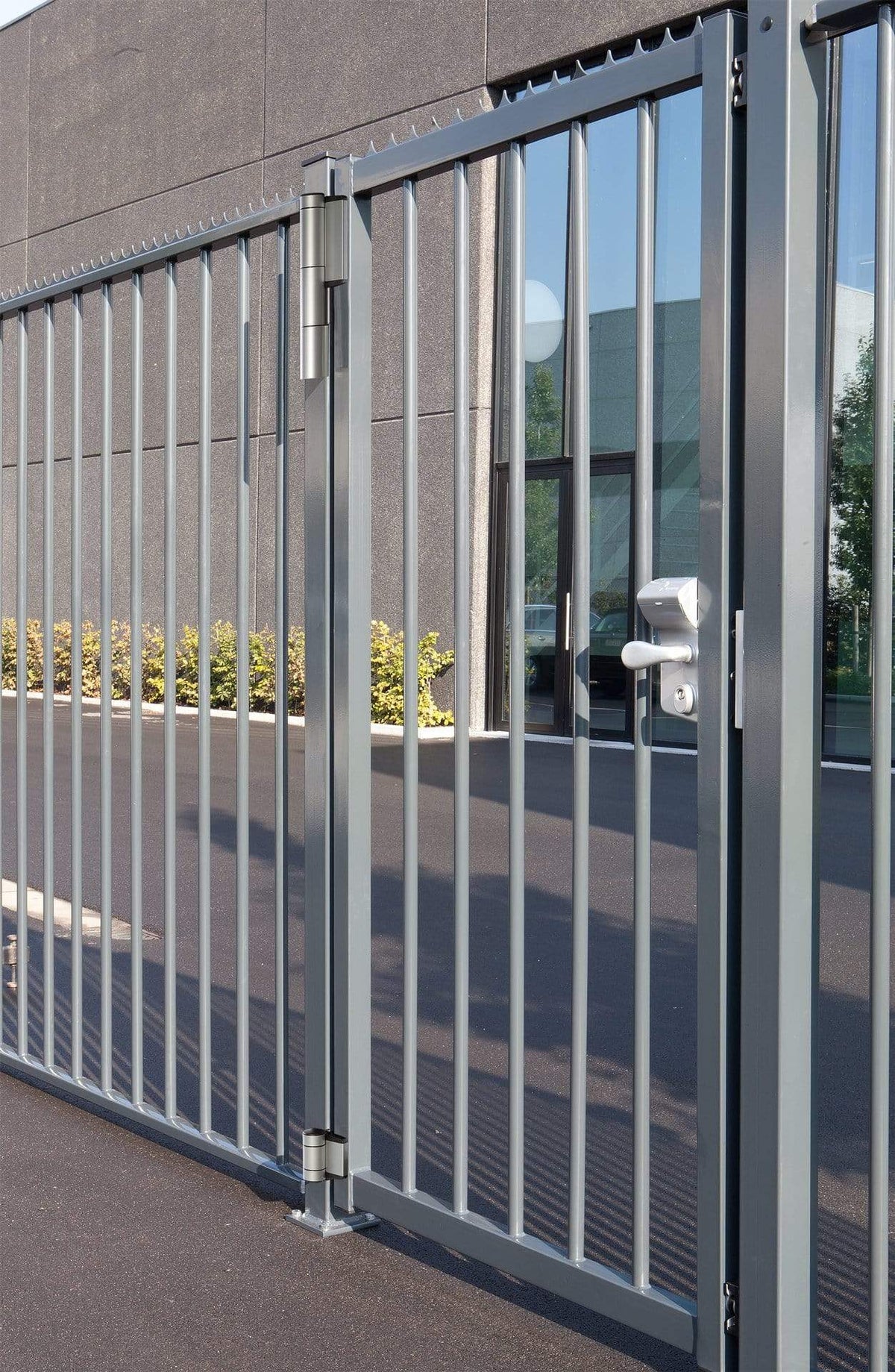 Two-way adjustable double bearing gate hinges installed on a modern gate, supporting up to 330 lbs, available in multiple finishes.