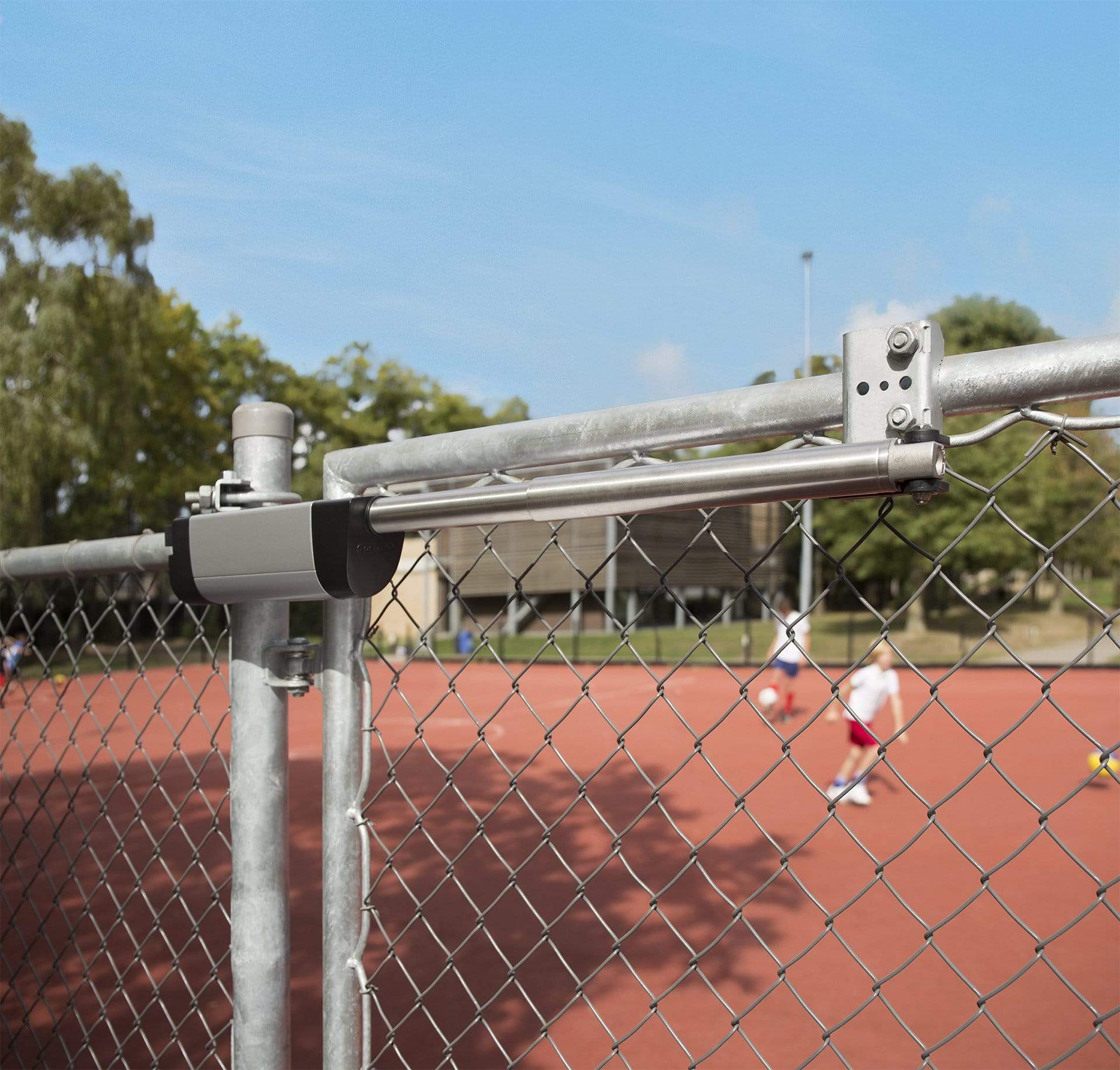Hydraulic retrofit gate closer for wide gates up to 330 lbs, featuring a silver finish and durable design.