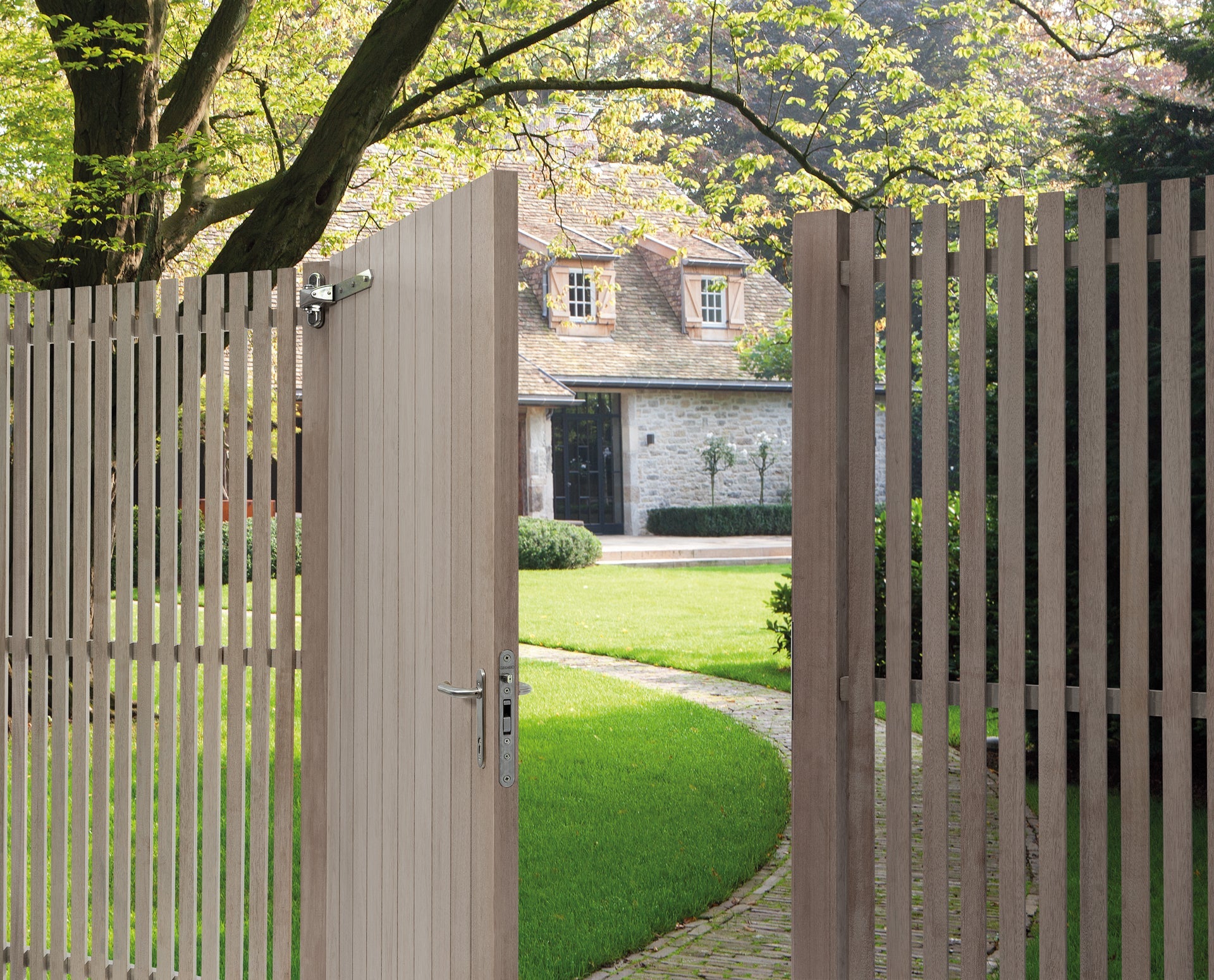 Mortise lock for wooden gates shown on an open gate, enhancing security and style for outdoor spaces.