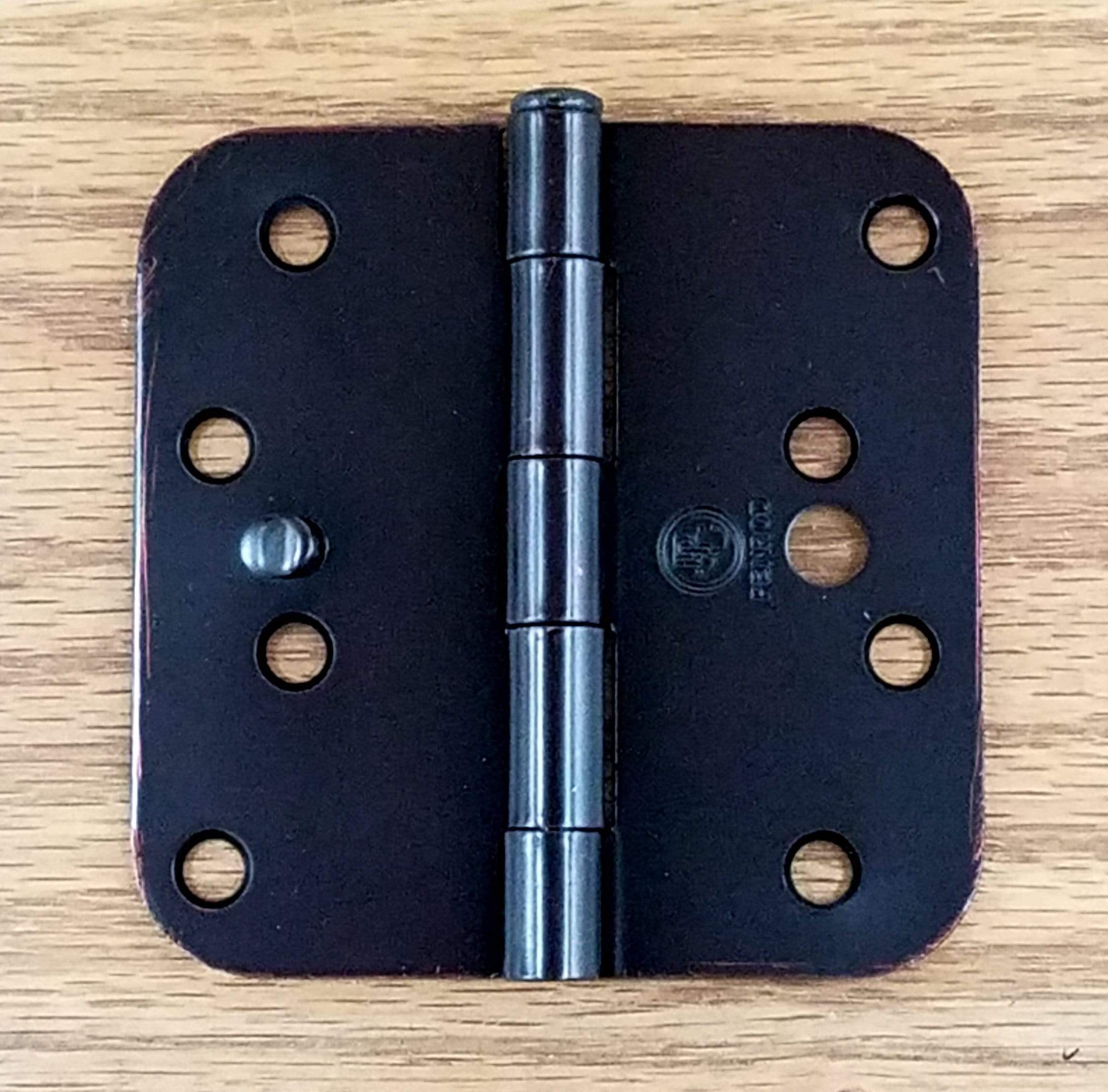 Oil rubbed bronze door hinge with security tab, 4 inches, 5/8 inch radius corners, sold in a pack of three.