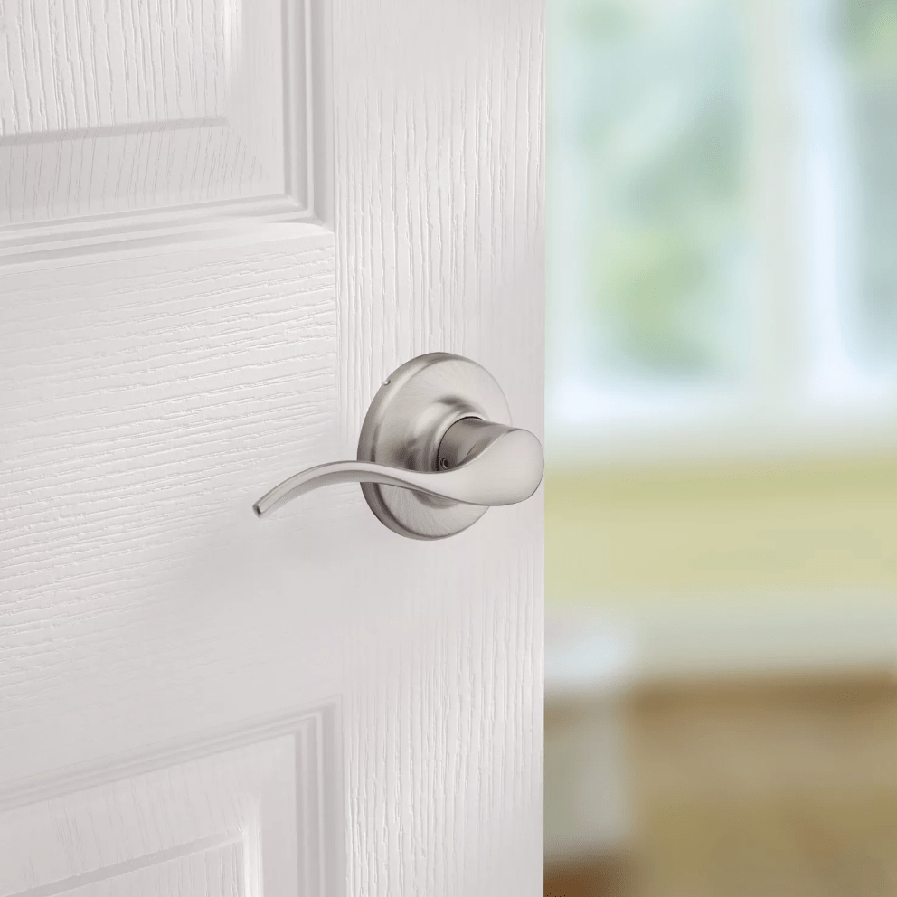 Satin nickel non-locking passage lever door handle in Balboa style with Microban antimicrobial protection.
