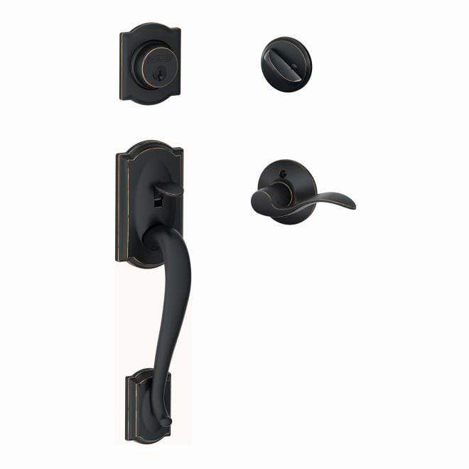 Schlage single cylinder handleset in Camelot style with aged bronze finish, featuring accent interior design.