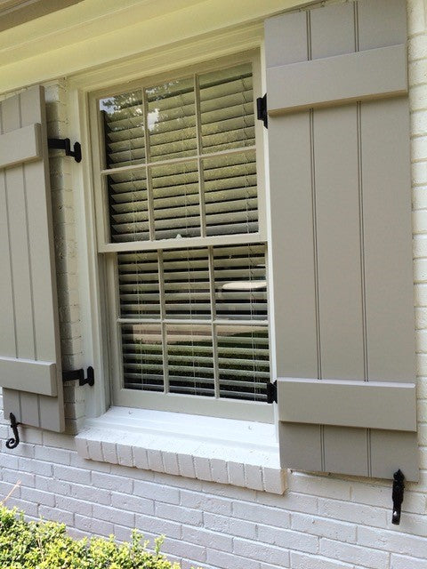 Black powder-coated cast iron rat tail shutter dogs and tiebacks, 6-1/4 inches, displayed on a window with shutters.