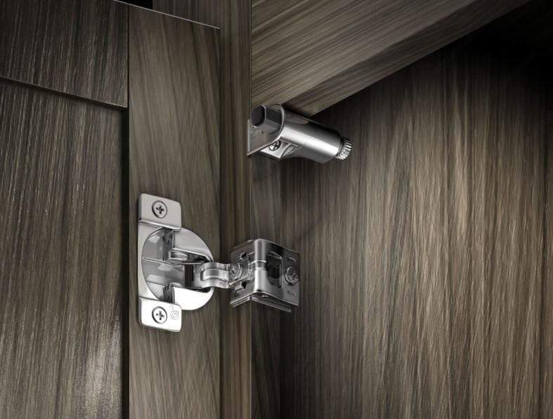 Silver cabinet hinge door damper for face frame cabinets, featuring a soft close mechanism for smooth operation.