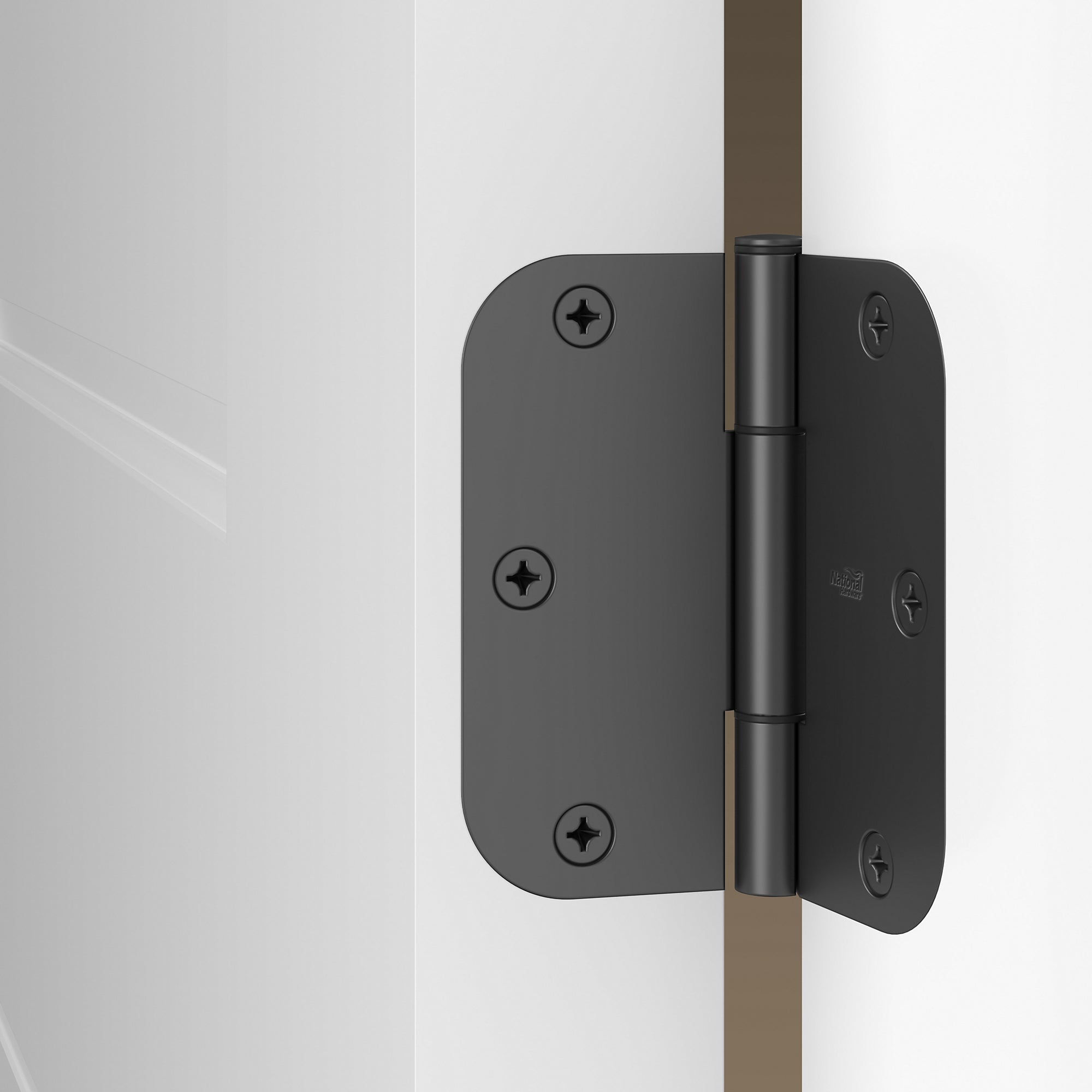 Squeak-free 3.5-inch interior door hinge with 5/8-inch radius, available in multiple finishes, shown installed on a door.