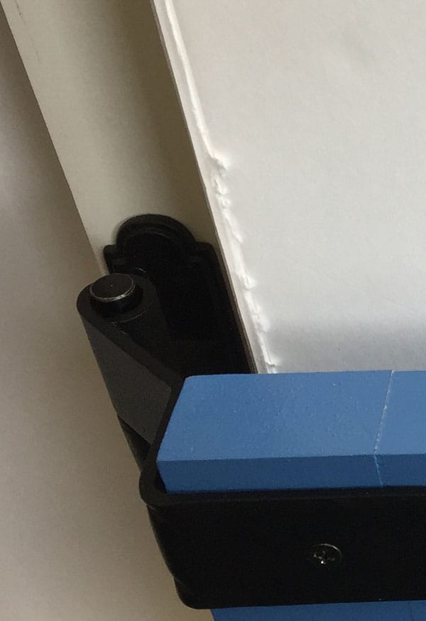 Black powder-coated strap hinge for shutters, 12 inches long with a 1.5-inch offset, featuring a circle tip design.