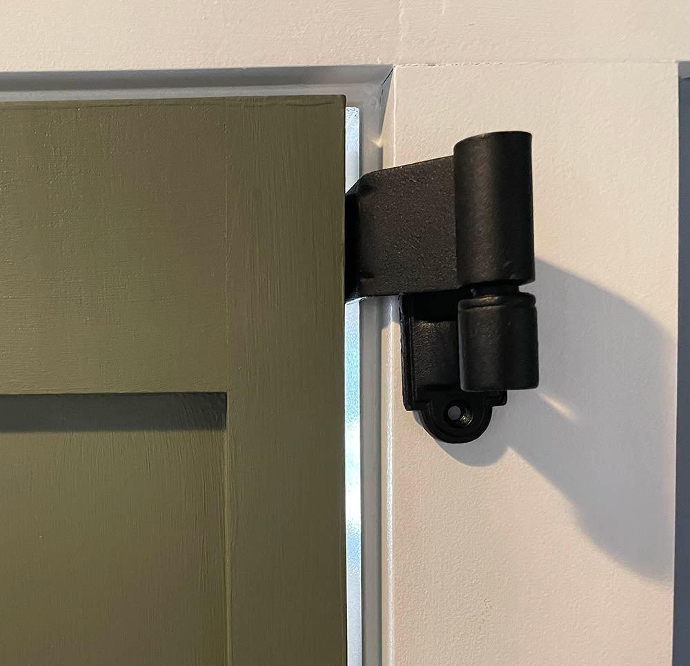 Black powder-coated strap hinge for shutters, 12 inches long with a 1.5-inch offset, showcasing a circle tip design.