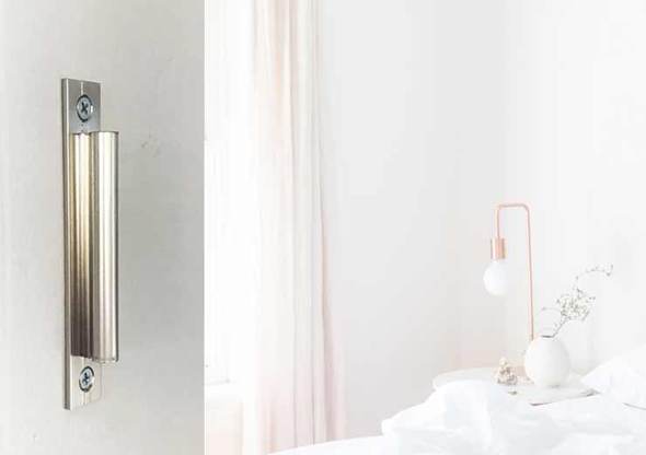 Traditional hinge hanger for behind-the-door storage, available in multiple finishes with a mounting bracket included.