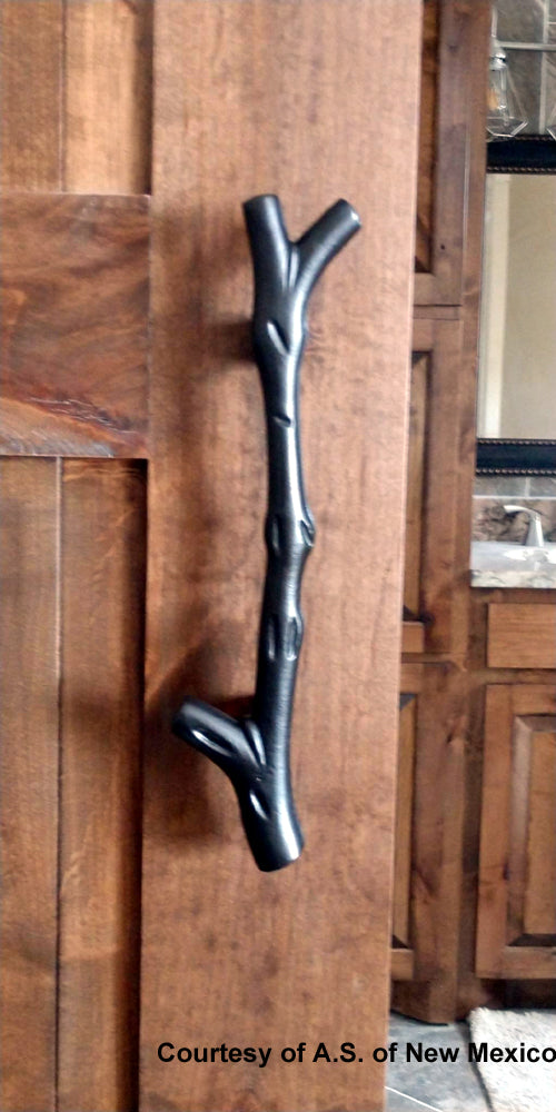 Large tree branch barn door handle with a textured finish, sold as a set with a matching flush pull in various finishes.