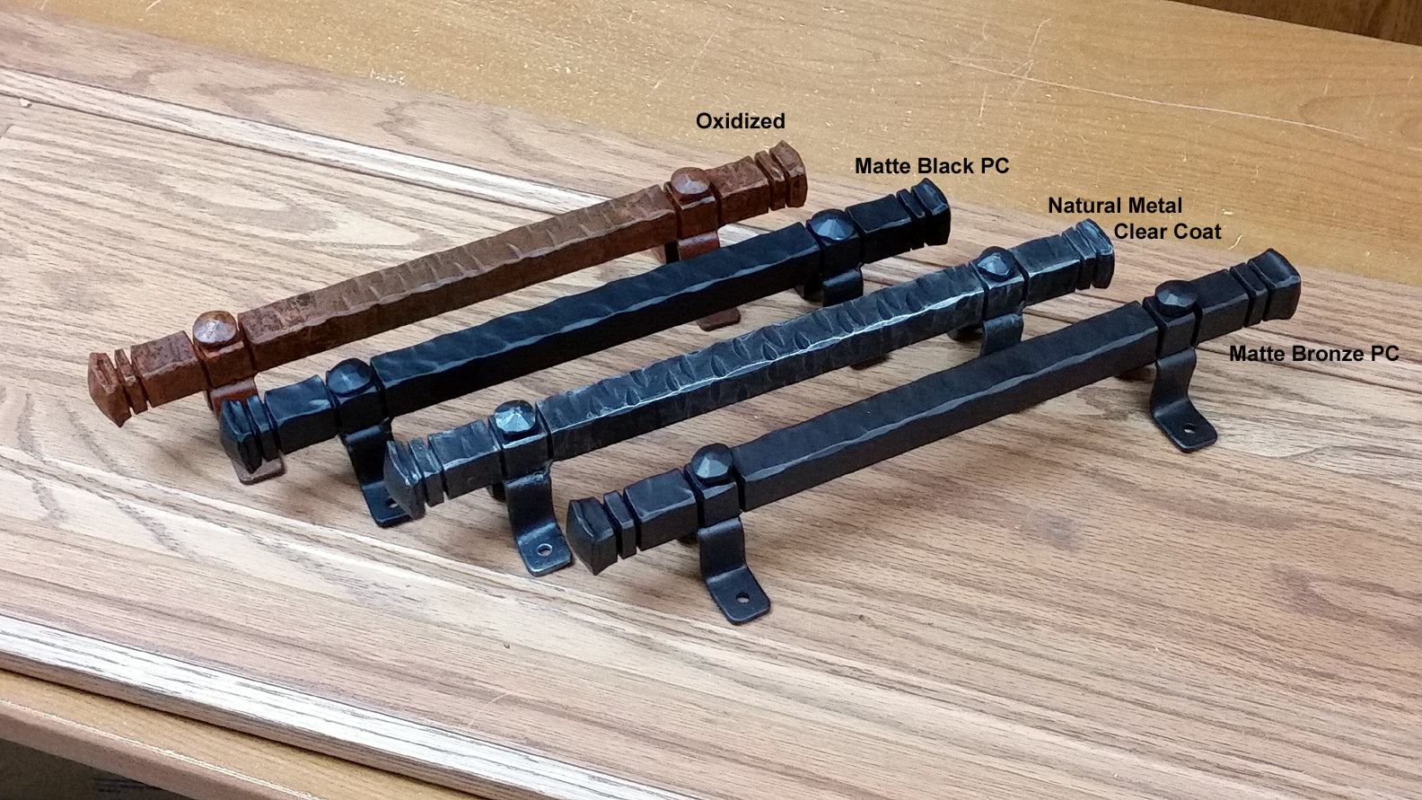 Bridge door pull handles in 13-inch size, available in oxidized, matte black, natural metal, and matte bronze finishes.