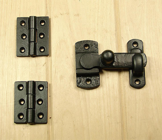 Black powder coat door and gate grille mounting kit with hinges and latch, sold as a set for secure installation.