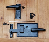 Cottage style gate latch kit with levers, screws, and installation rod for right and left handing two-way gates.
