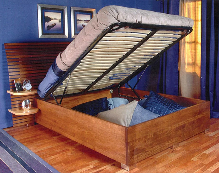 Hydraulic lift storage bed with frame and slats, showcasing open storage space beneath the mattress in a stylish room.