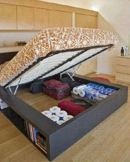 Hydraulic lift storage bed with frame and slats, showcasing under-bed storage for luggage and supplies.