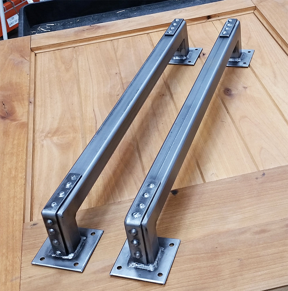 Industrial-style barn door handle pull with studded bracket ends, 24 inches, available in multiple finishes.