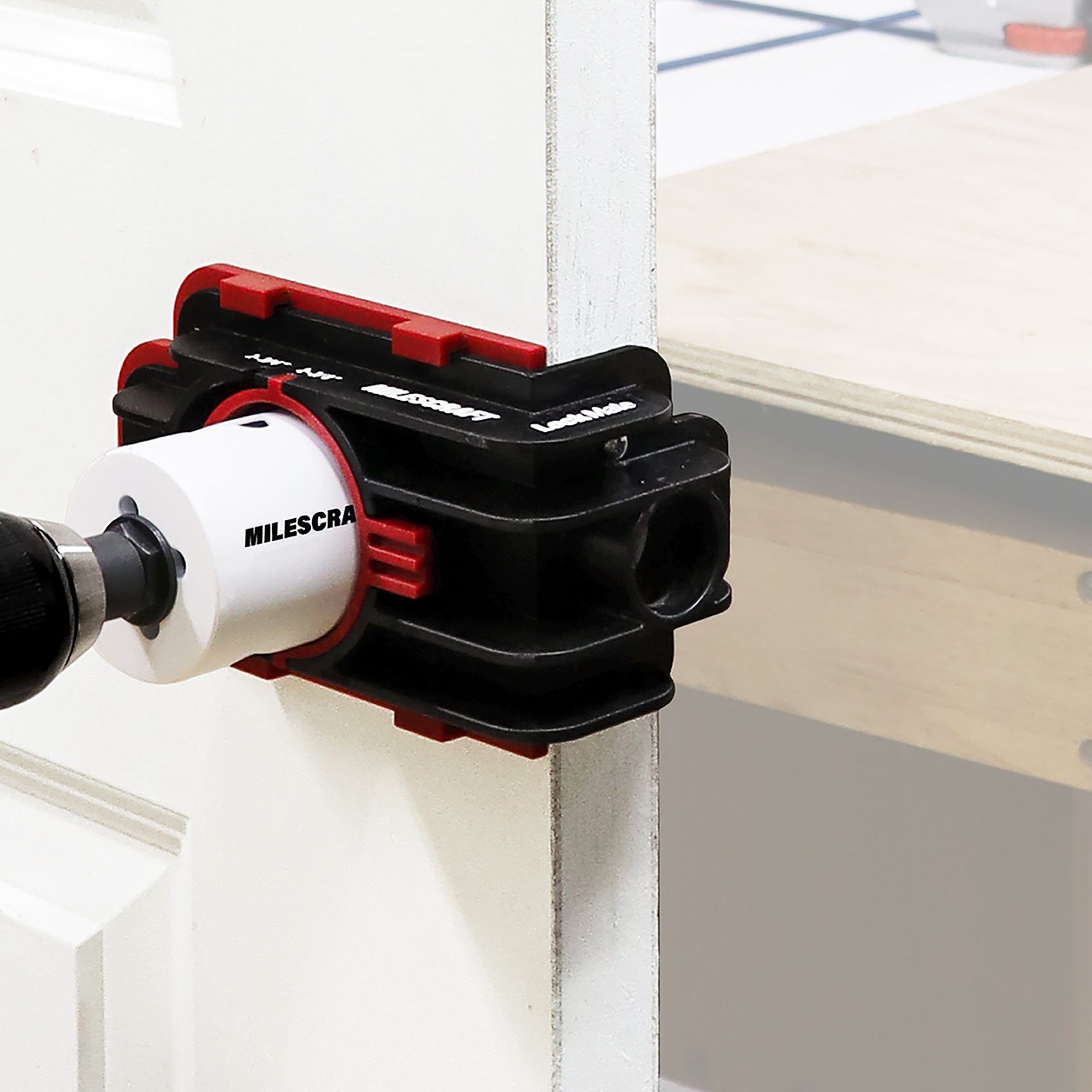 LockMate installation jig securely holds locks in place for precise drilling, enhancing door lock installation efficiency.
