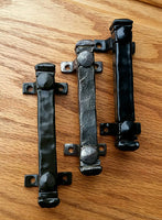 Mini 4-inch bridge door pulls in three finishes: black, textured gray, and smooth black, ideal for stylish door hardware.