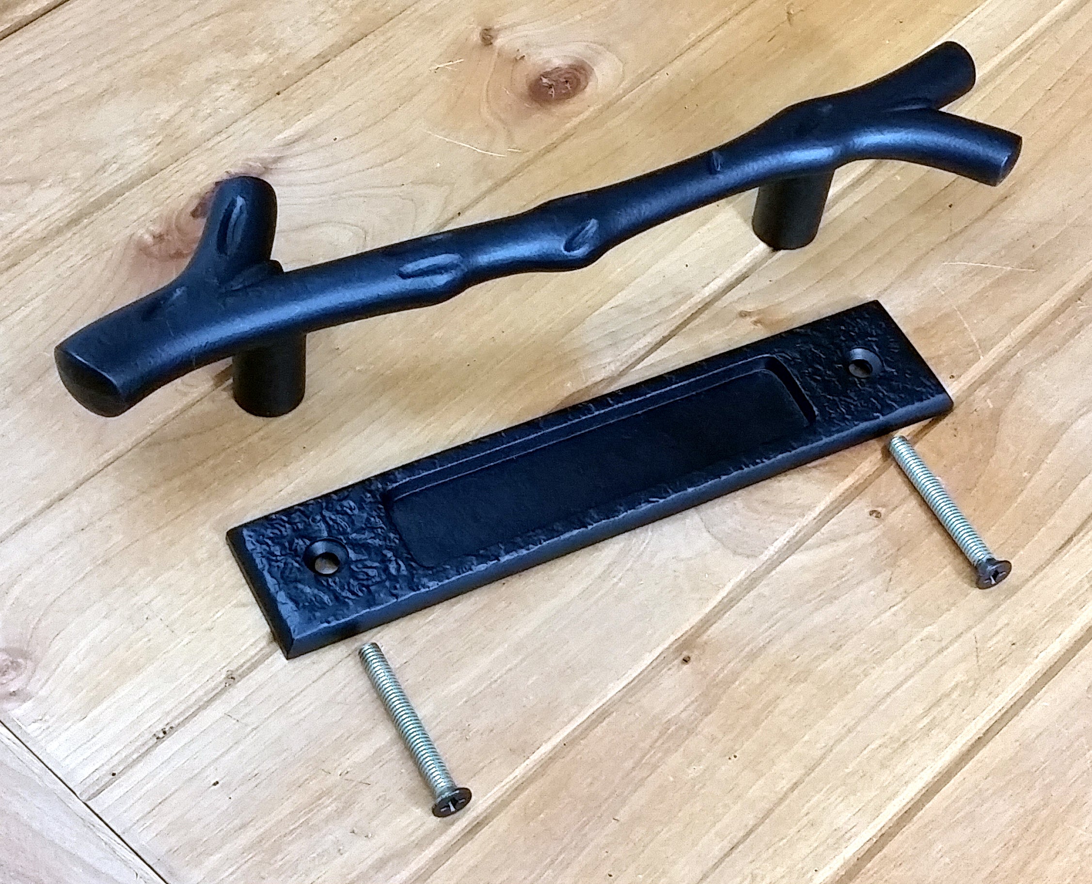 Large tree branch barn door handle with matching textured flush pull, available in multiple finishes, sold as a set.