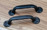 Economy Colonial door handle pull designed for barn doors, featuring a sleek black finish and mounting holes.