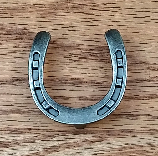Horseshoe pull knob in old silver finish, ideal for cabinets and drawers, sold individually.