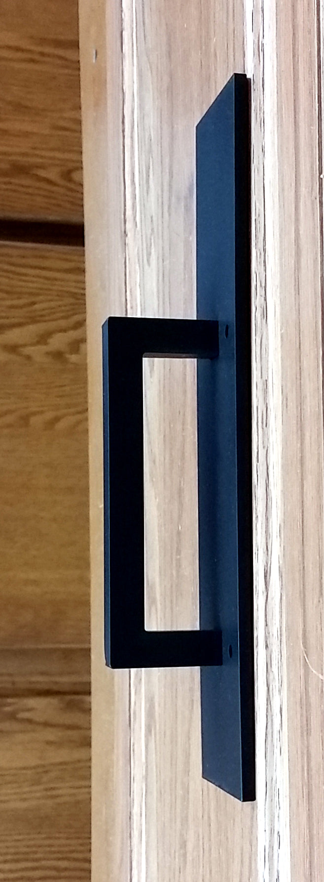 Plain rectangular style door pull for barn doors, 10 inches long, available in multiple finishes, sold individually.
