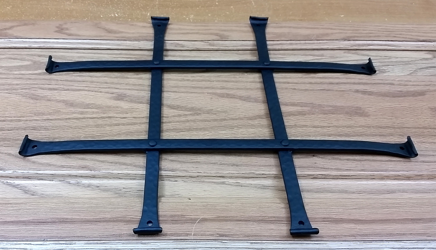 Low profile curled tip door and gate grille in black powder coat, 8x10 inches, featuring four bars, sold individually.